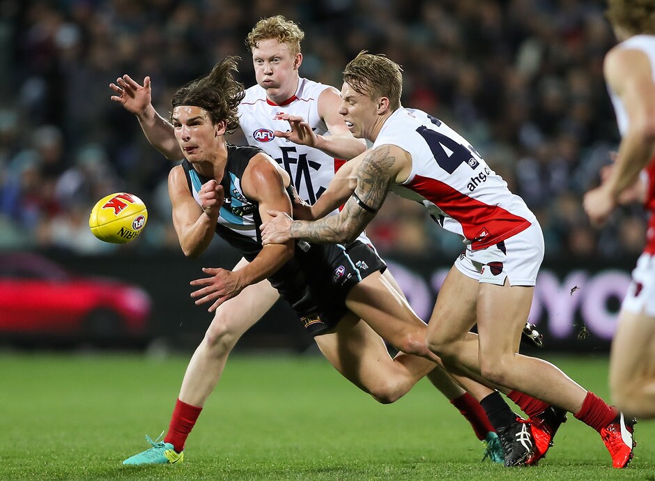 AFL 2016 Rd 21 - Port Adelaide v Melbourne ADELAIDE, AUSTRALIA - AUGUST 13: Jesse Palmer of the Power tackled by Clayton Oliver and James Harmes of the Demons during the 2016 AFL Round 21 match between Port Adelaide Power and the Melbourne Demons at the Adelaide Oval on August 13, 2016 in Adelaide, Australia. (Photo by AFL Media)